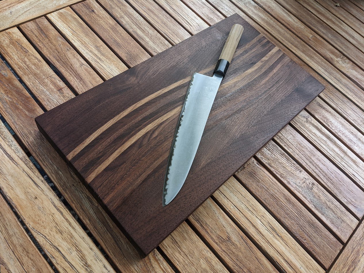 Walnut wave cutting board with Japanese knife