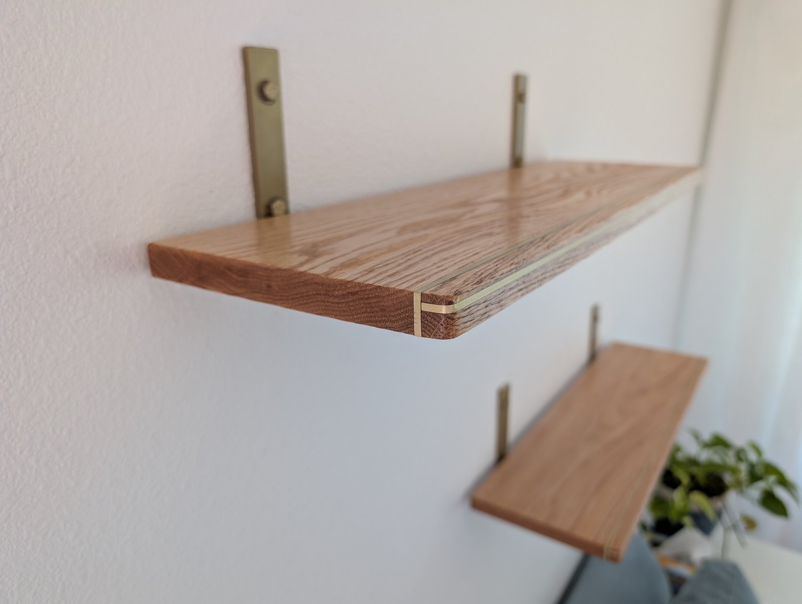 White oak shelves with brass inlay